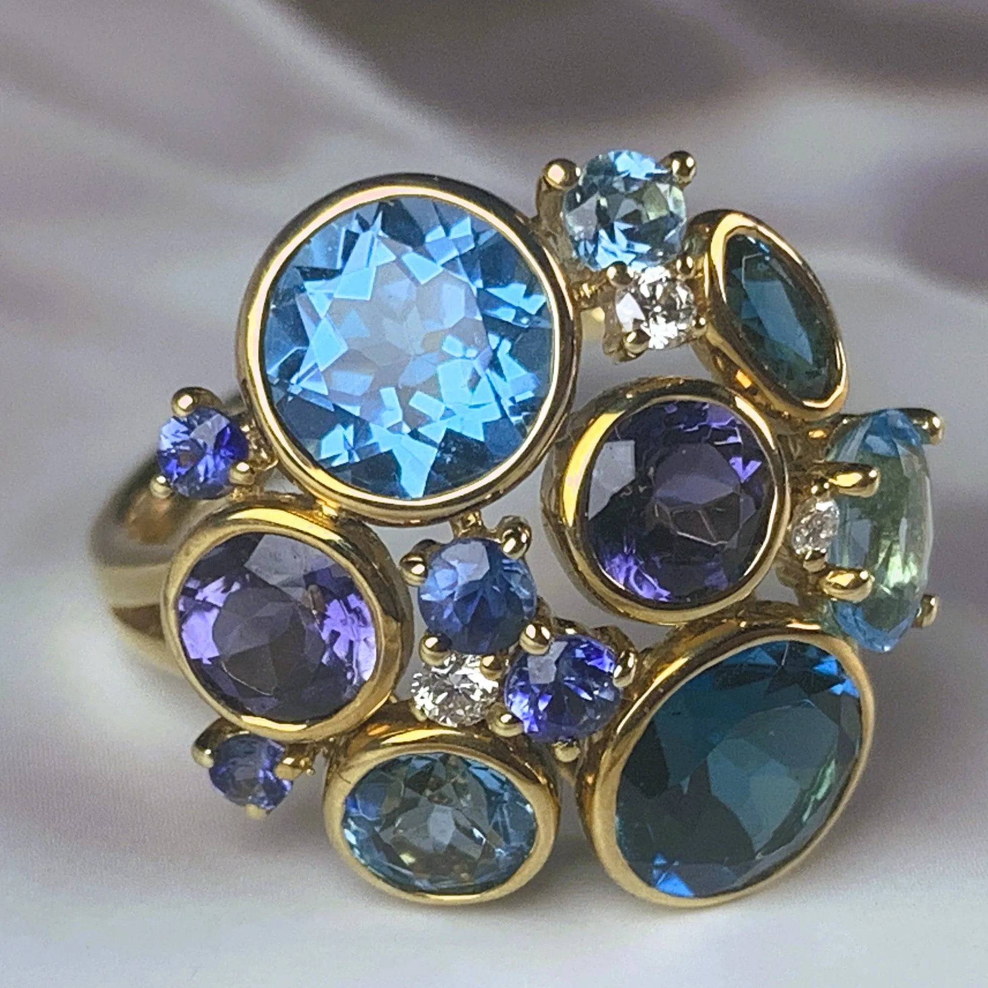 18kt Yellow Gold designer cluster ring with Tanzanite, Blue Topaz and Iolite